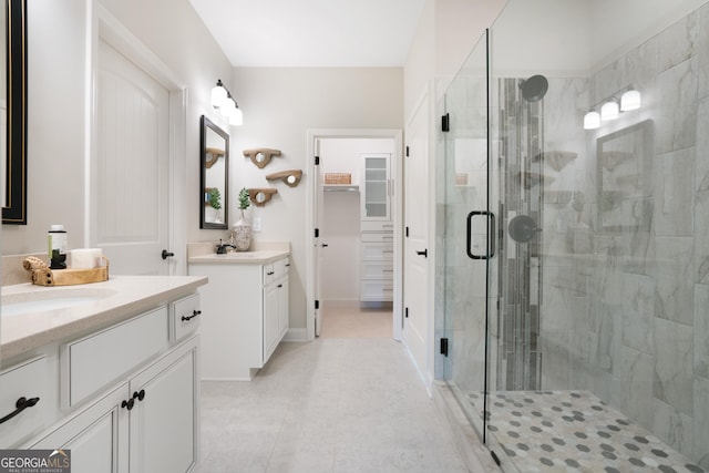 550 Azalea Xing, Dallas, GA 30132 - full bathroom featuring a stall shower, two vanities, and tile patterned flooring