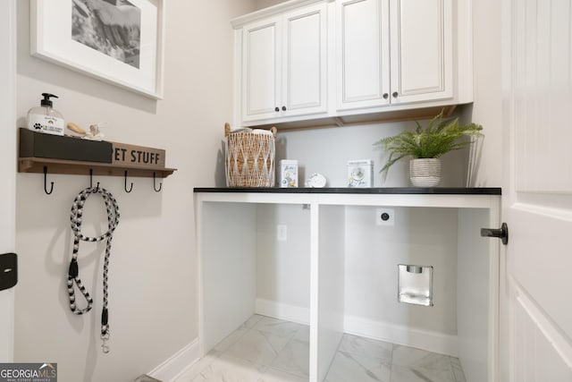 550 Azalea Xing, Dallas, GA 30132 - laundry area with electric dryer hookup, cabinet space, and light marble finish flooring