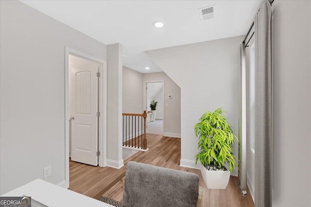 550 Azalea Xing, Dallas, GA 30132 - hall with an upstairs landing, light wood-style flooring, and recessed lighting