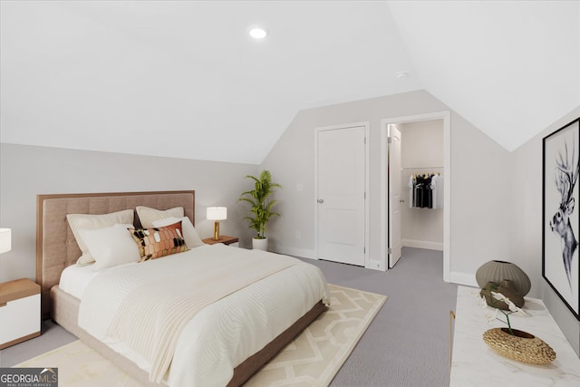 550 Azalea Xing, Dallas, GA 30132 - carpeted bedroom featuring lofted ceiling, a walk in closet, and recessed lighting