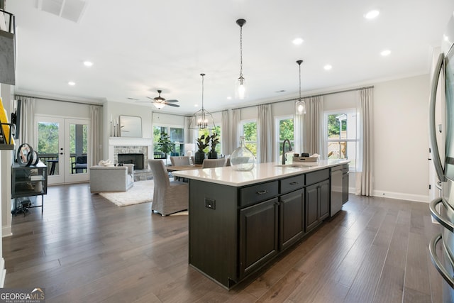 550 Azalea Xing, Dallas, GA 30132 - kitchen featuring stainless steel appliances, light countertops, healthy amount of natural light, a ceiling fan, and recessed lighting