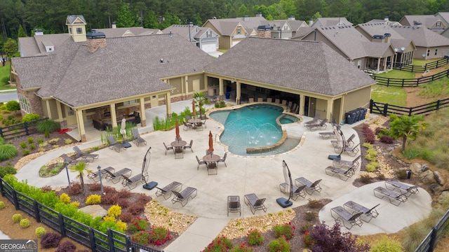 550 Azalea Xing, Dallas, GA 30132 - view of swimming pool with a fire pit, a fenced backyard, outdoor dining area, a patio, and a residential view