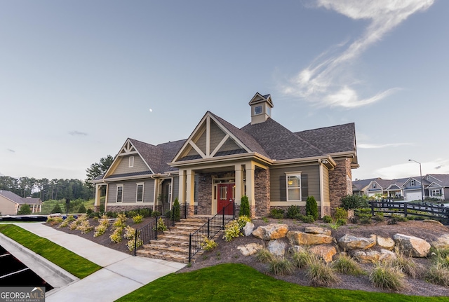 550 Azalea Xing, Dallas, GA 30132 - craftsman-style home featuring stone siding and roof with shingles