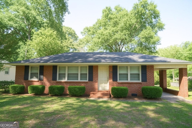 5530 Perry Ave, Columbus, GA 31909 - ranch-style home with a front yard, brick siding, a carport, roof with shingles, and entry steps