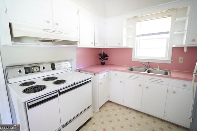 5530 Perry Ave, Columbus, GA 31909 - kitchen with white electric stove, ventilation hood, open shelves, and white cabinetry