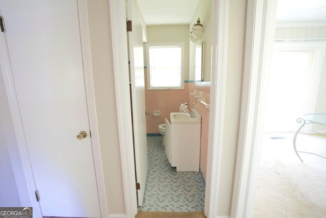 5530 Perry Ave, Columbus, GA 31909 - hallway featuring carpet flooring and tile walls