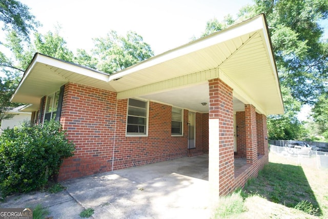 5530 Perry Ave, Columbus, GA 31909 - view of property exterior with driveway, brick siding, and an attached carport