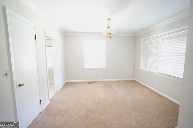 5530 Perry Ave, Columbus, GA 31909 - unfurnished room featuring light carpet, crown molding, and a chandelier