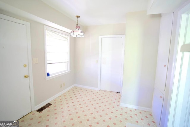5530 Perry Ave, Columbus, GA 31909 - unfurnished dining area with light flooring and baseboards