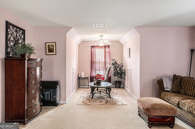 11961 Markham Way, Hampton, GA 30228 - living area featuring light colored carpet, ceiling fan, a textured ceiling, and vaulted ceiling