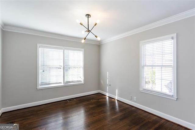 469 Mellview Ave, Atlanta, GA 30310 - unfurnished room featuring a chandelier, healthy amount of natural light, dark wood-type flooring, and ornamental molding