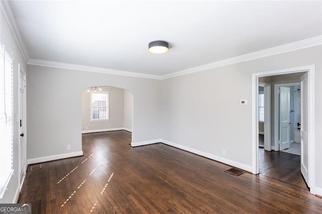 469 Mellview Ave, Atlanta, GA 30310 - empty room featuring ornamental molding, arched walkways, and dark wood-type flooring