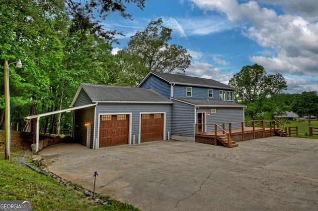 67 Mcnelley Dr, Morganton, GA 30560 - view of front facade with concrete driveway, a garage, and a deck