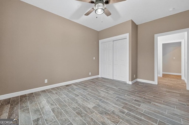 67 Mcnelley Dr, Morganton, GA 30560 - unfurnished bedroom featuring a closet, wood finished floors, and ceiling fan