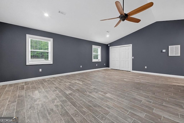 67 Mcnelley Dr, Morganton, GA 30560 - unfurnished bedroom featuring vaulted ceiling, wood finished floors, ceiling fan, a closet, and recessed lighting