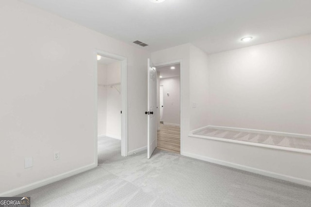 5560 Pilgrim Point Ext, Cumming, GA 30041 - unfurnished bedroom featuring carpet floors, a closet, and a spacious closet