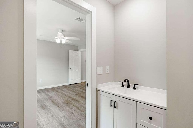119 Church St S, Bogart, GA 30622 - bathroom featuring a ceiling fan, wood finished floors, and vanity