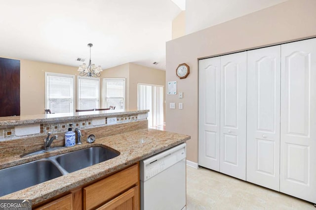 5069 Kathryn Glen Dr, Acworth, GA 30101 - kitchen featuring white dishwasher, a chandelier, light tile patterned flooring, hanging light fixtures, and light stone counters