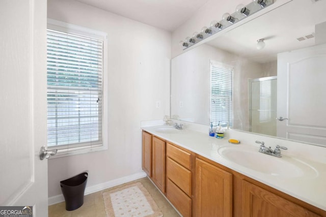 5069 Kathryn Glen Dr, Acworth, GA 30101 - bathroom with a stall shower, double vanity, healthy amount of natural light, and tile patterned flooring