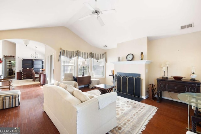 5069 Kathryn Glen Dr, Acworth, GA 30101 - living area with arched walkways, a ceiling fan, lofted ceiling, wood finished floors, and a fireplace with flush hearth