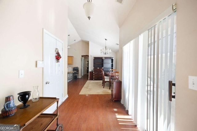5069 Kathryn Glen Dr, Acworth, GA 30101 - entryway featuring a chandelier, wood finished floors, and high vaulted ceiling