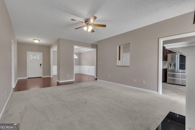 502 Creekside Dr, Lagrange, GA 30240 - unfurnished living room featuring carpet and a ceiling fan