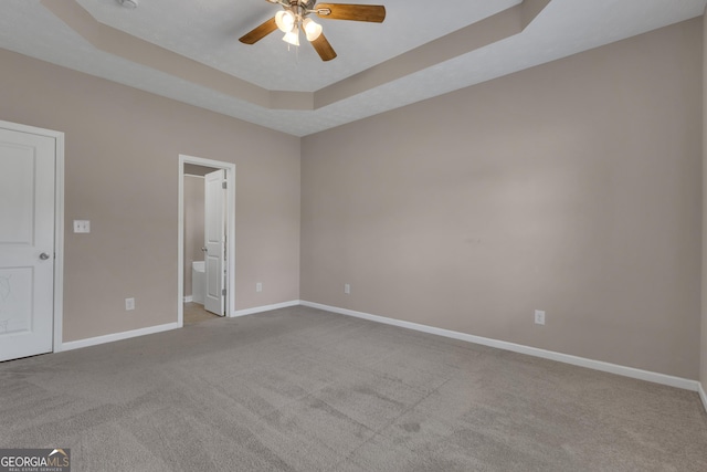502 Creekside Dr, Lagrange, GA 30240 - empty room with carpet flooring, a ceiling fan, and a tray ceiling