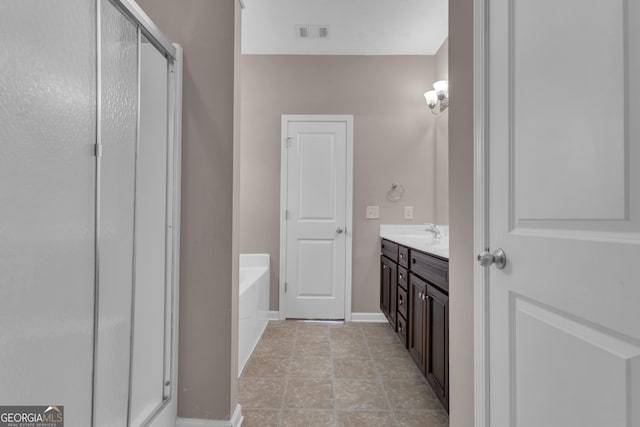 502 Creekside Dr, Lagrange, GA 30240 - full bath featuring a bath, vanity, and a stall shower