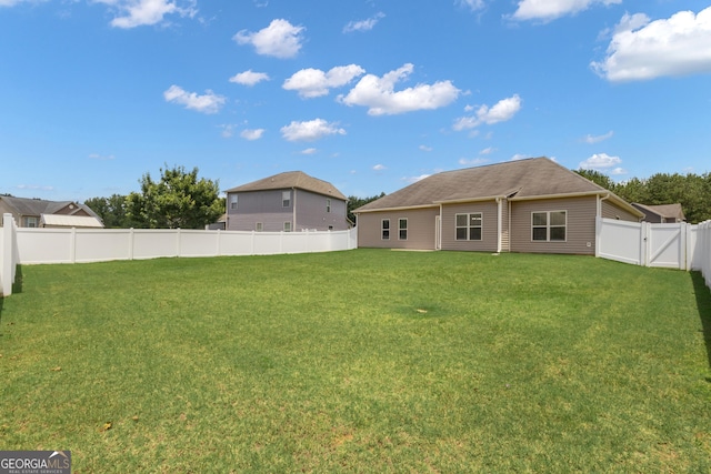 502 Creekside Dr, Lagrange, GA 30240 - rear view of house with a fenced backyard and a gate