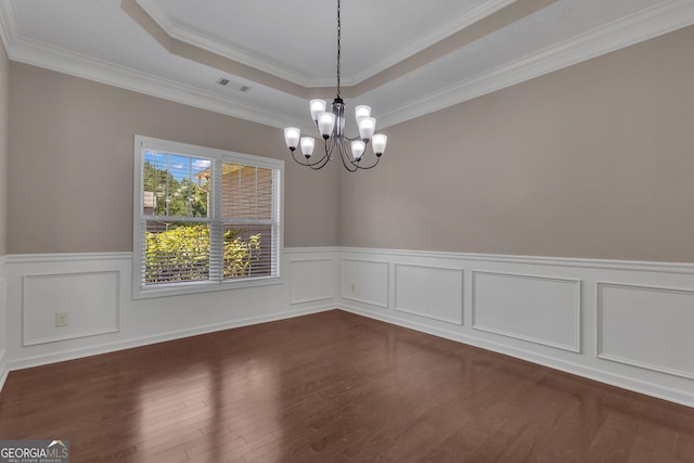 502 Creekside Dr, Lagrange, GA 30240 - unfurnished room featuring a chandelier, dark wood-style flooring, a wainscoted wall, a tray ceiling, and ornamental molding