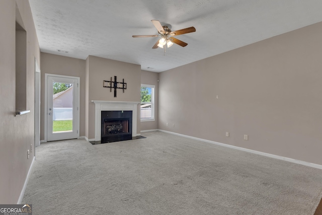 502 Creekside Dr, Lagrange, GA 30240 - unfurnished living room with a ceiling fan, a premium fireplace, and carpet