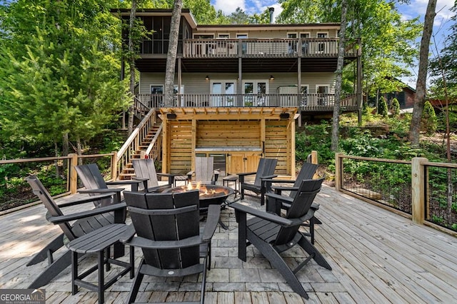 128 Overlake Ct, Morganton, GA 30560 - rear view of house with an outdoor fire pit, a wooden deck, and stairs