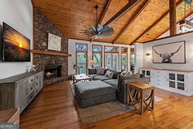 128 Overlake Ct, Morganton, GA 30560 - living area featuring a wooden ceiling with exposed beams, high vaulted ceiling, wood-type flooring, ceiling fan, and a stone fireplace