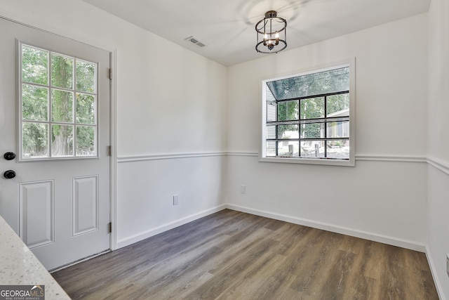 205 Shadowood Ln, Peachtree City, GA 30269 - unfurnished dining area with plenty of natural light, wood finished floors, and a chandelier