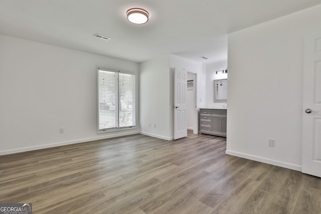 205 Shadowood Ln, Peachtree City, GA 30269 - unfurnished bedroom featuring wood finished floors and baseboards