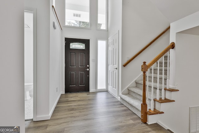 205 Shadowood Ln, Peachtree City, GA 30269 - foyer with stairs, wood finished floors, and a high ceiling