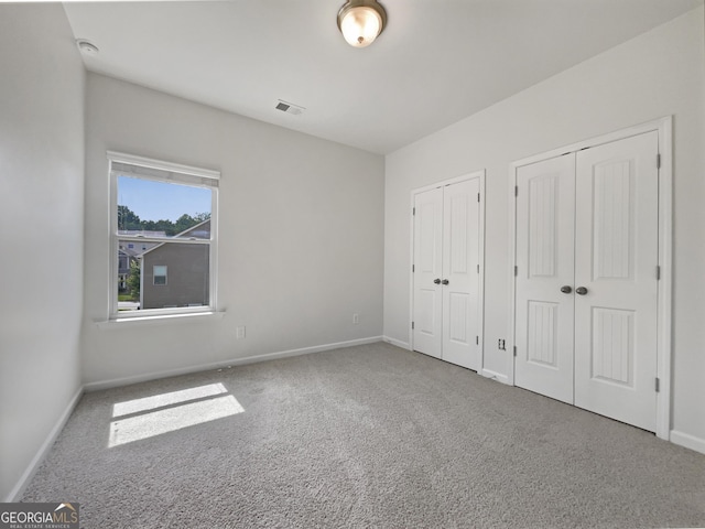 36 Crescent Chase, Dallas, GA 30157 - unfurnished bedroom featuring multiple closets and carpet flooring