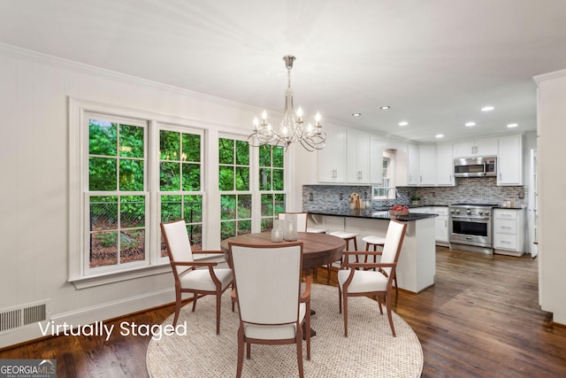 750 Crest Valley Dr NW, Sandy Springs, GA 30327 - dining area with a chandelier, dark wood finished floors, ornamental molding, and recessed lighting