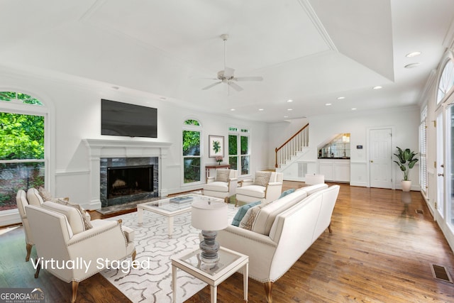 750 Crest Valley Dr NW, Sandy Springs, GA 30327 - living area featuring wood finished floors, a ceiling fan, a premium fireplace, recessed lighting, and stairway