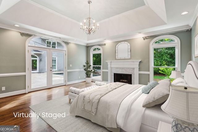 750 Crest Valley Dr NW, Sandy Springs, GA 30327 - bedroom with access to outside, multiple windows, crown molding, a chandelier, and wood finished floors