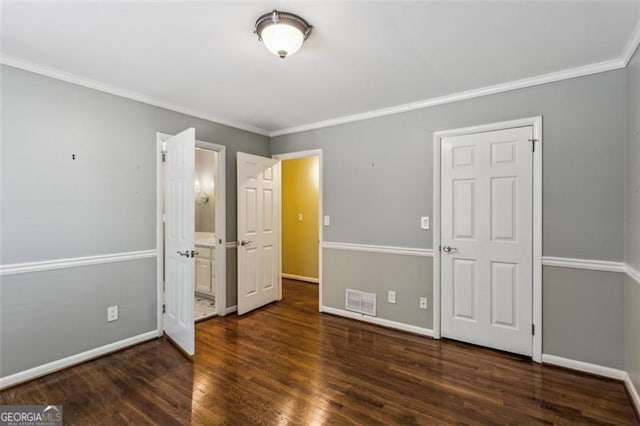 750 Crest Valley Dr NW, Sandy Springs, GA 30327 - unfurnished bedroom featuring ornamental molding, wood finished floors, and connected bathroom