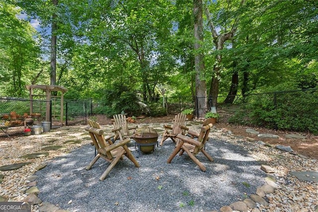 750 Crest Valley Dr NW, Sandy Springs, GA 30327 - view of patio with a fire pit
