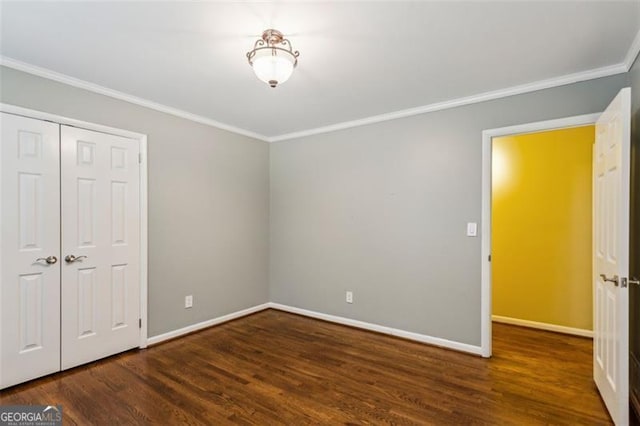 750 Crest Valley Dr NW, Sandy Springs, GA 30327 - unfurnished bedroom with ornamental molding, wood finished floors, and a closet