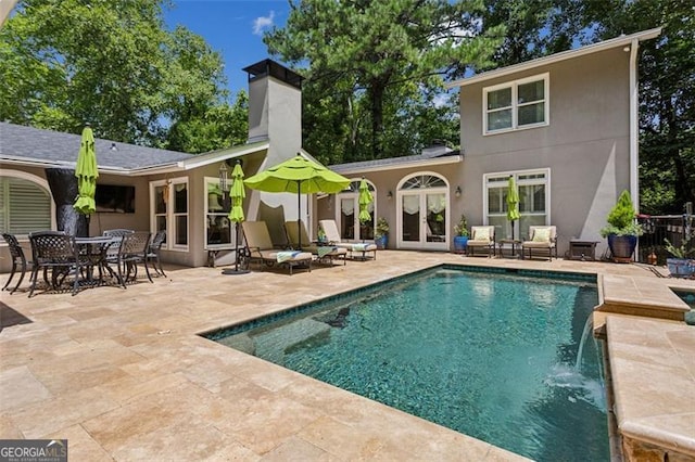 750 Crest Valley Dr NW, Sandy Springs, GA 30327 - swimming pool featuring french doors and a patio area