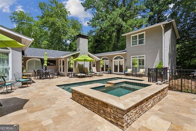 750 Crest Valley Dr NW, Sandy Springs, GA 30327 - view of swimming pool featuring french doors, an in-ground hot tub, a patio area, and outdoor dining area