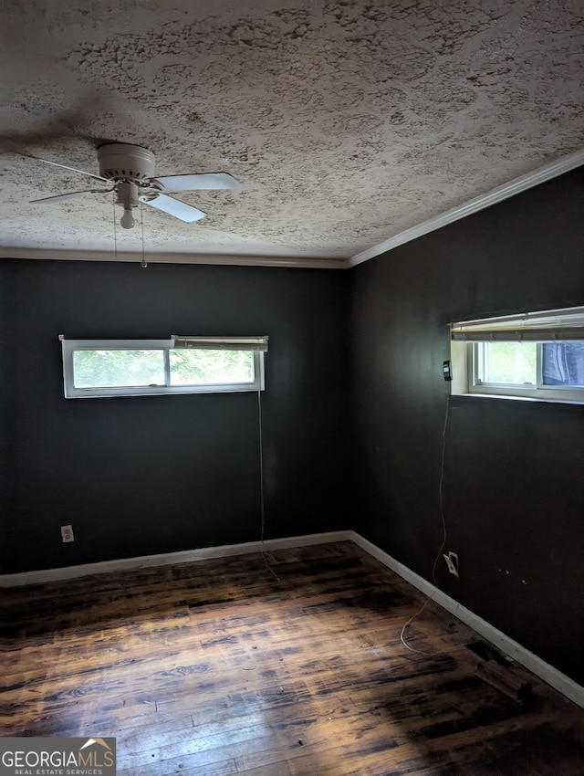 1750 Beechwood Blvd SW, Atlanta, GA 30311 - unfurnished room featuring wood finished floors, healthy amount of natural light, ornamental molding, a ceiling fan, and a textured ceiling