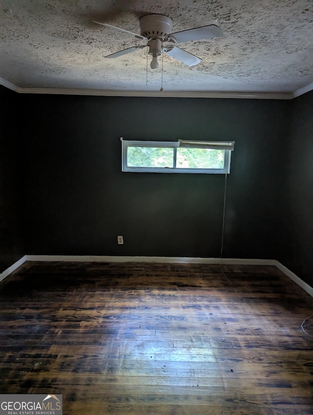 1750 Beechwood Blvd SW, Atlanta, GA 30311 - spare room featuring dark wood-style flooring, a ceiling fan, crown molding, and a textured ceiling
