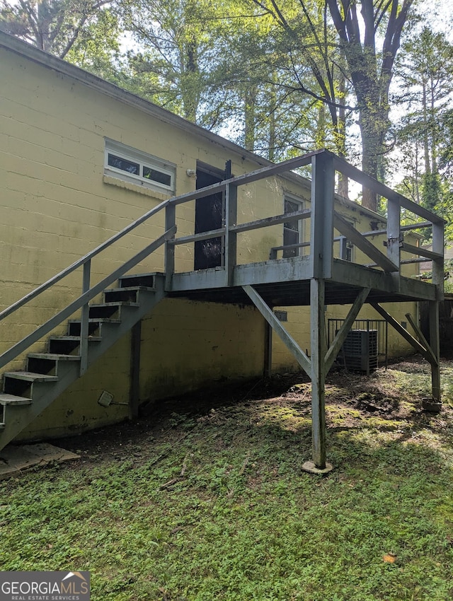 1750 Beechwood Blvd SW, Atlanta, GA 30311 - view of side of property with stairway, a wooden deck, and concrete block siding