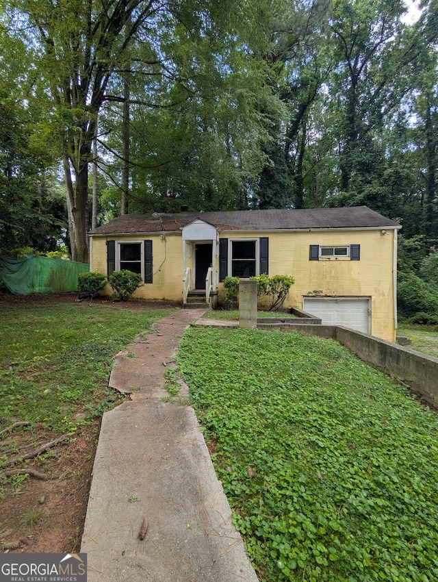 1750 Beechwood Blvd SW, Atlanta, GA 30311 - single story home with concrete block siding, an attached garage, and a front yard