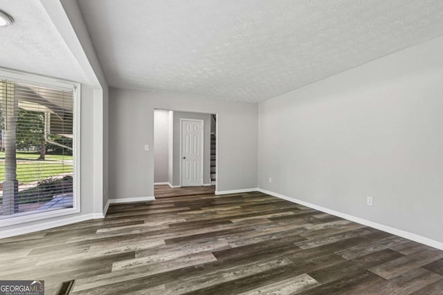 2849 Snapfinger Rd, Decatur, GA 30034 - unfurnished room featuring a textured ceiling and wood finished floors